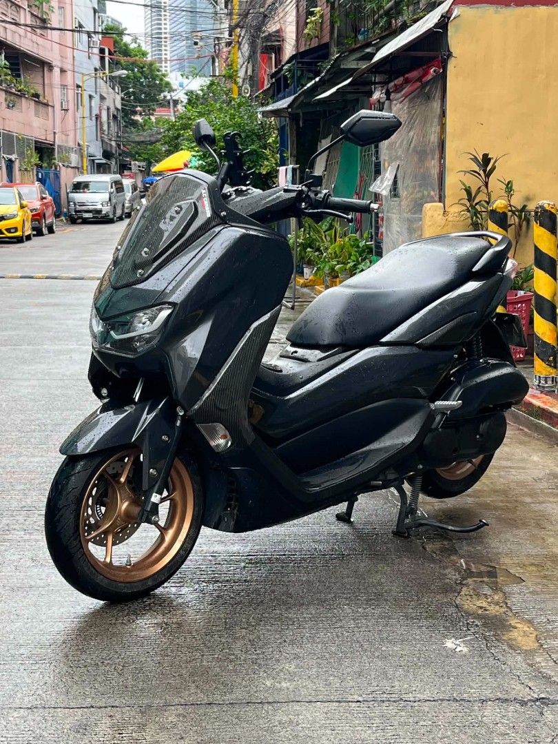 NMAX 155cc Motorcycle (Category: Motorbikes for Sale) located in Mandaluyong City. Submitted by love.riel (Listing ID 1455886901, Image 1). Description: Suzuki NMAX 155cc. Dark grey with carbon fiber accents. Has a phone mount installed. Clean and well-maintained. Ready for the road. Message for inquiries. For sale Open swap Price: 115K nego Nmax 155 v2.1 2024-2025 year model 18k odo Original papers With casa receipt Red code Open dos Id with sig