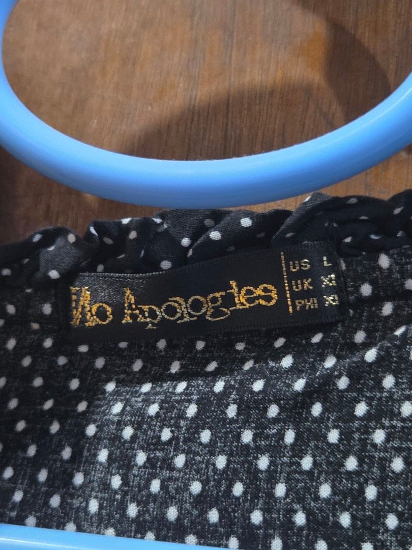 No Apologies Black Polka Dot Cap Sleeve Blouse Top (Category: Blouses) located in Quezon City. Submitted by chennister (Listing ID 1455991710, Image 2). Description: ​Brand: No Apologies ​Size: US L / UK XL / PH XL ​Features: Elastic cinched hem, cap sleeves, ruffled round neckline with front tie detail ​Color: Black with white polka dots ​Condition: Pre-loved, good condition with no stains or tears #NoApologies #PolkaDotBlouse #CasualTop #Office