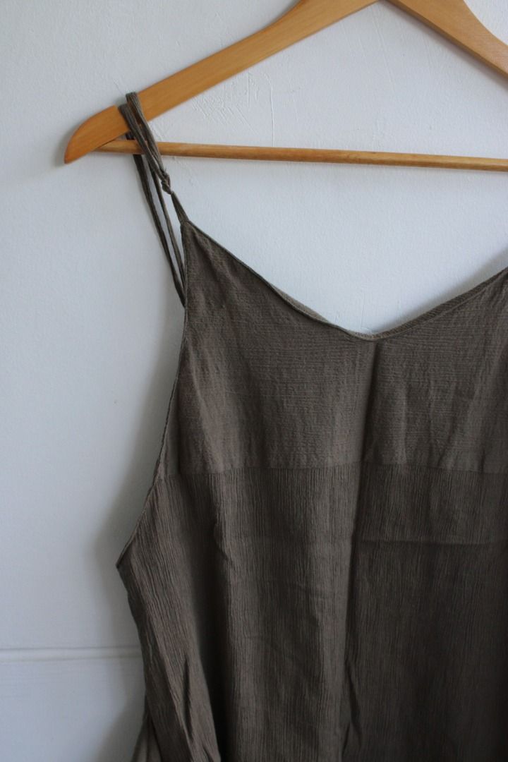 Olive Green Spaghetti Strap Asymmetrical Hem Dress (Category: Dresses) located in Aurora. Submitted by mothere (Listing ID 1455876134, Image 2). Description: - Olive green dress - V-neckline with spaghetti straps - Flowy asymmetrical hemline - Textured fabric - Simple and chic design 👌🏽 what you see in the photos is what you will get 🌸 discounts available if you buy other items 🍸 all flaws or issues will be mentioned 🐚 no rush shipping 🍍 fe