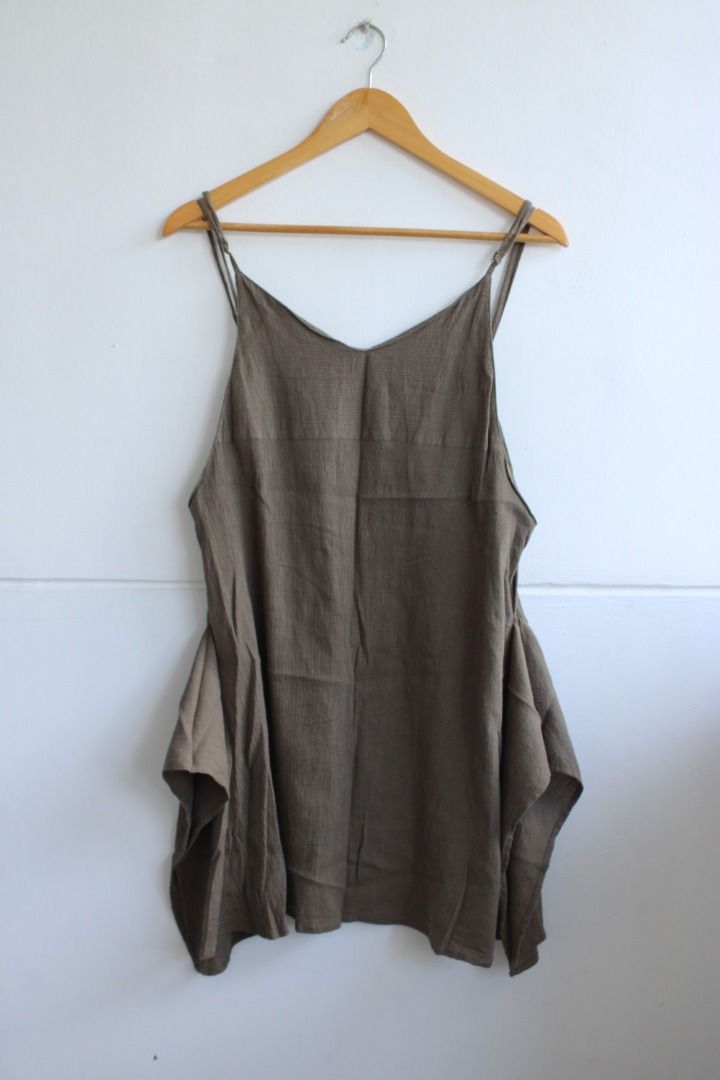 Olive Green Spaghetti Strap Asymmetrical Hem Dress (Category: Dresses) located in Aurora. Submitted by mothere (Listing ID 1455876134, Image 1). Description: - Olive green dress - V-neckline with spaghetti straps - Flowy asymmetrical hemline - Textured fabric - Simple and chic design 👌🏽 what you see in the photos is what you will get 🌸 discounts available if you buy other items 🍸 all flaws or issues will be mentioned 🐚 no rush shipping 🍍 fe