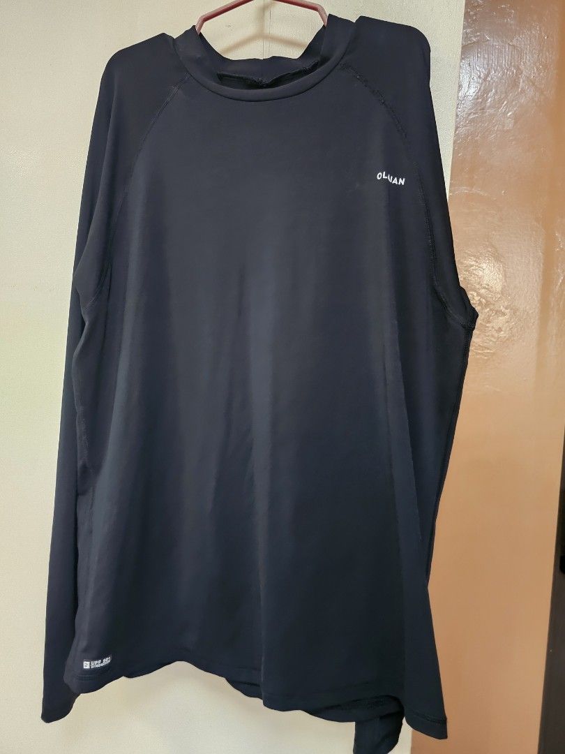 Decathlon Black Long Sleeve Drifit Shirts for PHP 50 each (Category: Activewear) located in Cainta. Submitted by ej_emuslan (Listing ID 1455899104, Image 2). Description: - Brand: OLVAN - Color: Black - Style: Long-sleeved shirt, athletic/performance top - Features: Raglan sleeves for enhanced movement - Versatility: Ideal for workouts or as a layering piece.