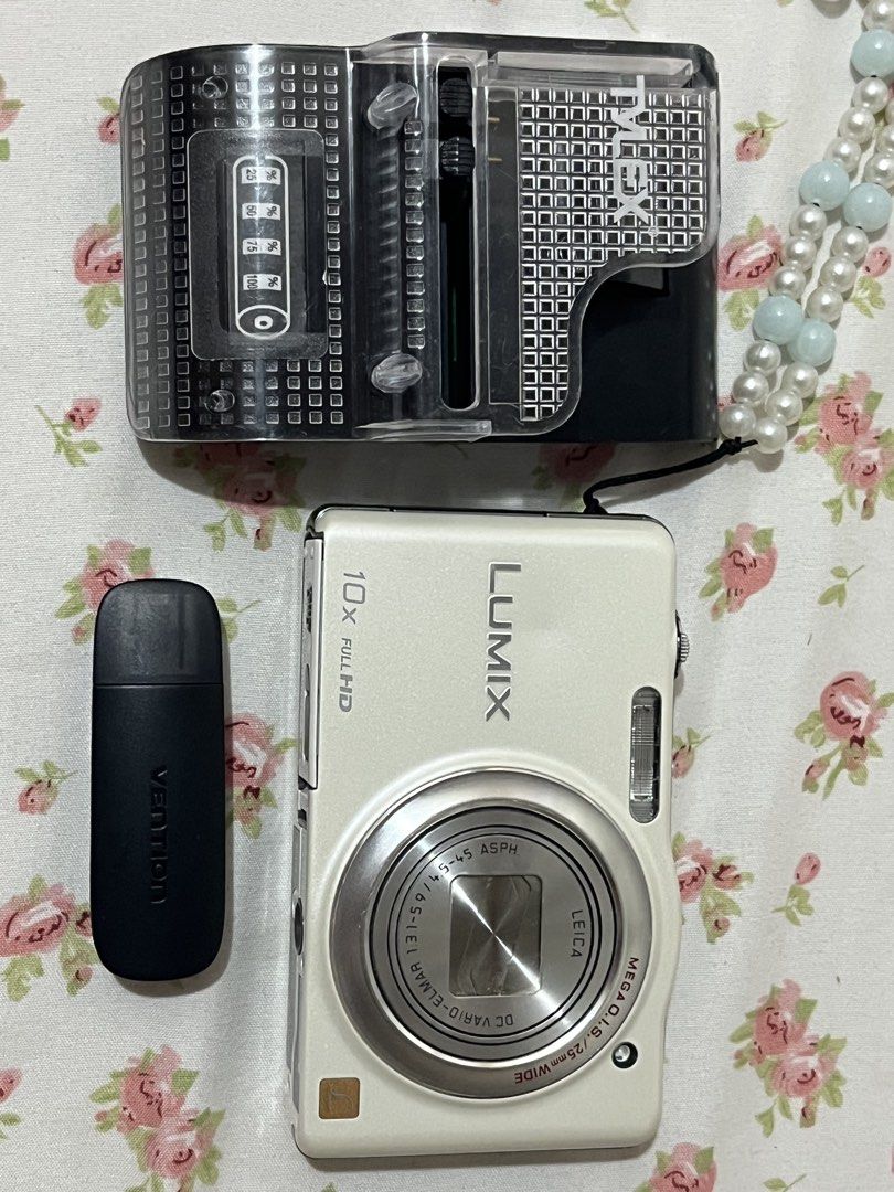 Panasonic Lumix DMC-SZ7 10x Optical Zoom Digital Camera (Category: Cameras) located in Taguig. Submitted by luckyforest-3ea7 (Listing ID 1455920225, Image 1). Description: - White Panasonic Lumix camera - 10x Full HD optical zoom - Leica DC Vario-Elmar lens - Records AVCHD video - Includes Verbatim USB drive - Great for both photos and videos - Selling as a bundle * Japanese language * Lens needs to be manually forced open and closed * Please see