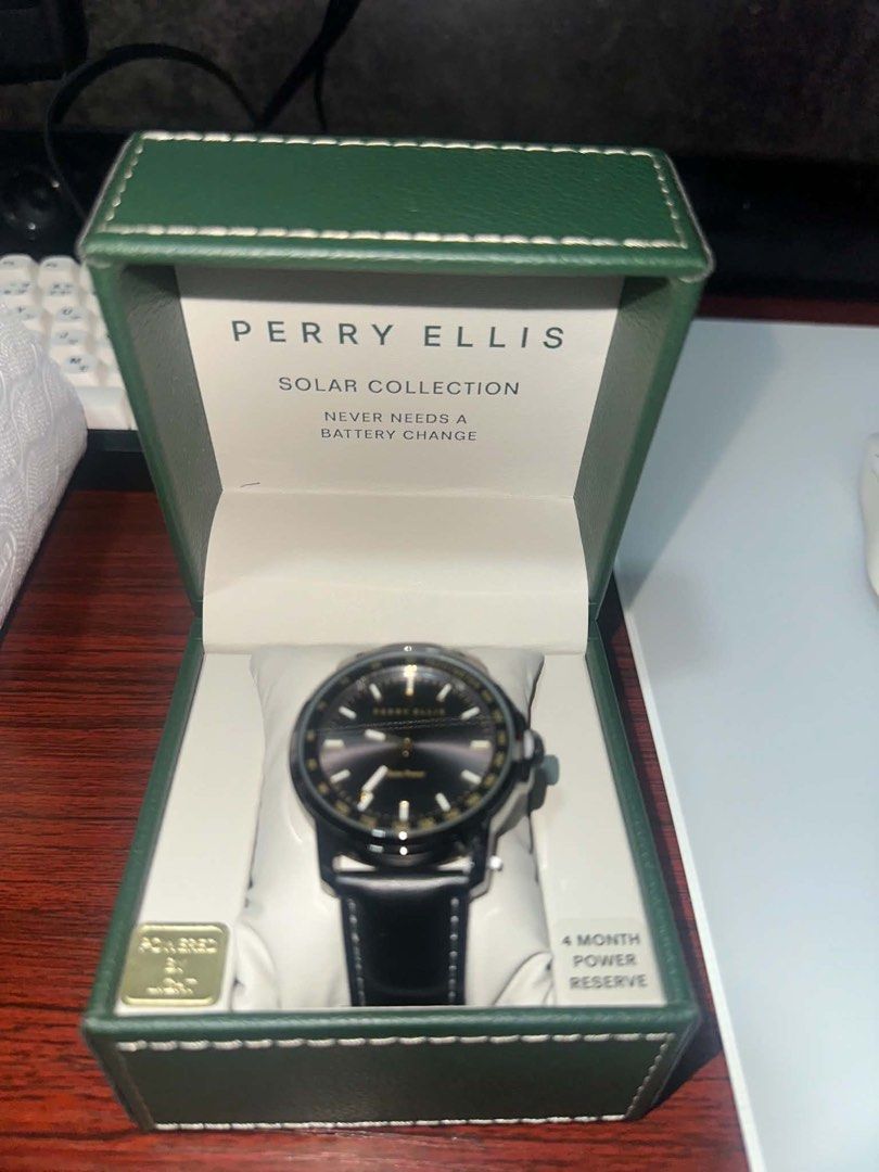 Perry Ellis Solar Collection Watch - Never Needs Battery Change (Category: Men's Watches) located in Manila. Submitted by elijahacun92606 (Listing ID 1455982854, Image 1). Description: - Perry Ellis watch from the Solar Collection - Never needs a battery change (solar-powered) - 4-month power reserve - Black leather strap - Black dial with elegant gold accents - Comes in its original box 6k perry ellis 4900 geoffrey Nego esp if get both.