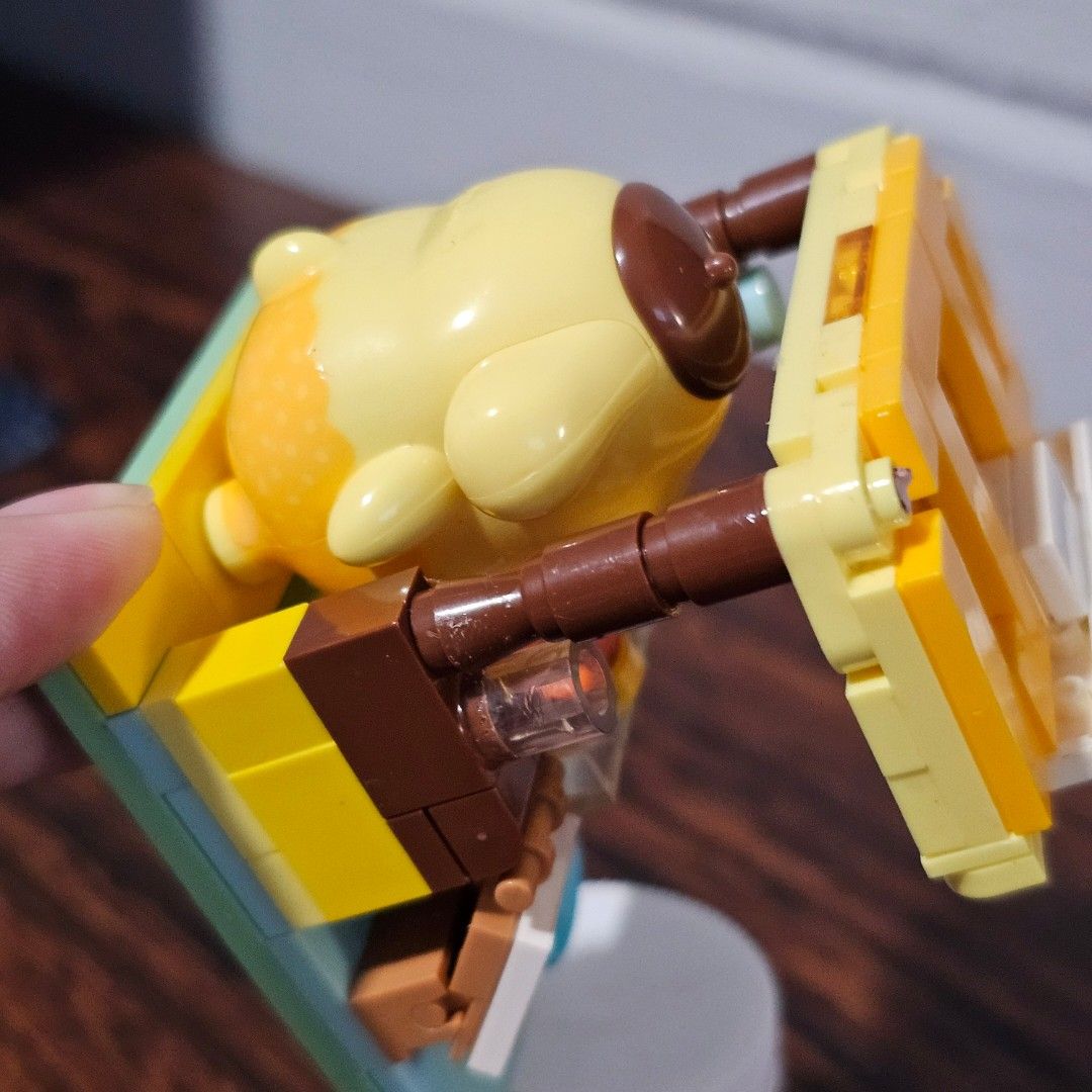 Pompompurin Cafe Building Blocks Set (Category: Lego & Building Sets) located in Rizal. Submitted by viviperera (Listing ID 1456028085, Image 2). Description: AS IS. all pieces glued together. might have some missing pieces - Cute Pompompurin cafe building block set - Comes with Pompompurin figure - Includes food accessories and cafe counter - Ideal for Sanrio character fans - Fun to build and display - Assembled as shown in photos.