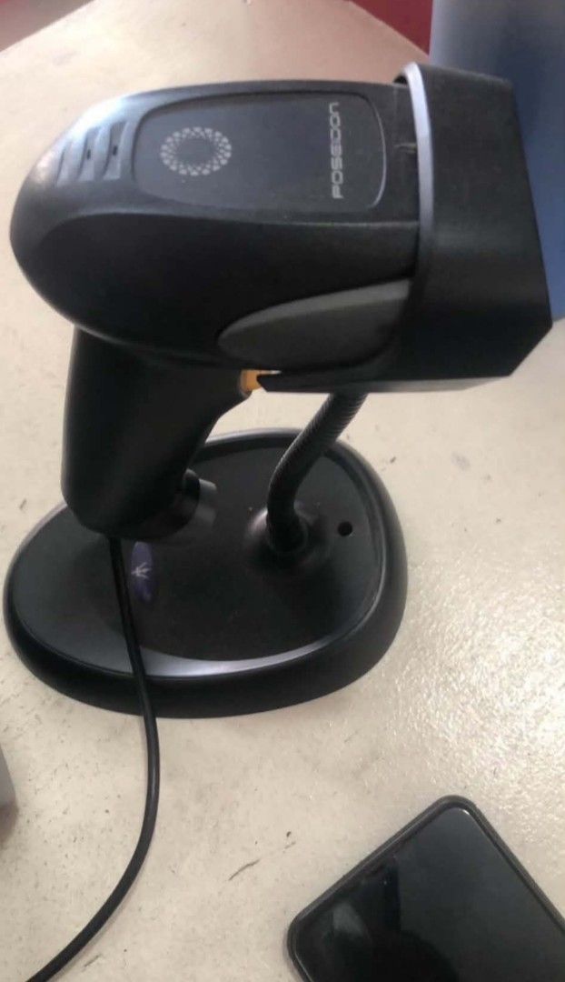 Poseidon Barcode Scanner with Stand (Category: Printers, Scanners & Copiers) located in Manila. Submitted by qjvcuento99069 (Listing ID 1455856388, Image 2). Description: - Poseidon barcode scanner - Includes original stand - Color: Black - Perfect for retail or inventory management - Fully functional and in great working condition - Reason for selling: No longer required - Feel free to ask any questions!.