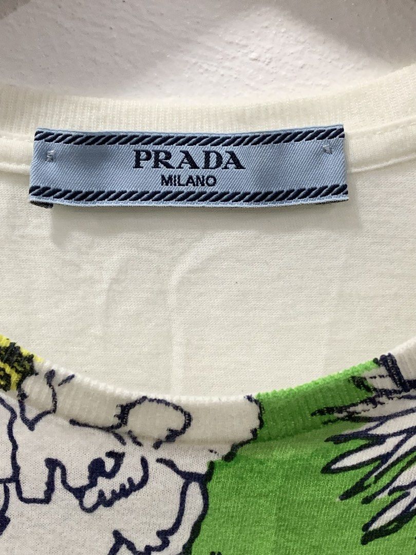 PRADA FLORAL PRINTED T-SHIRT (Category: Tshirts & Polo Shirts ) located in Cavite. Submitted by ___layern0ne (Listing ID 1455938292, Image 2). Description: Tagged Size: S Armpit to Armpit (front): 17.5 inches Shoulder to Shoulder: 15 inches Sleeve Length: 6 inches Front body length: 22.5 inches Measured laid flat and at its longest point | Slightly stretchable Slightly wrinkled due to storage Overall Condition: The item is in great, functional co