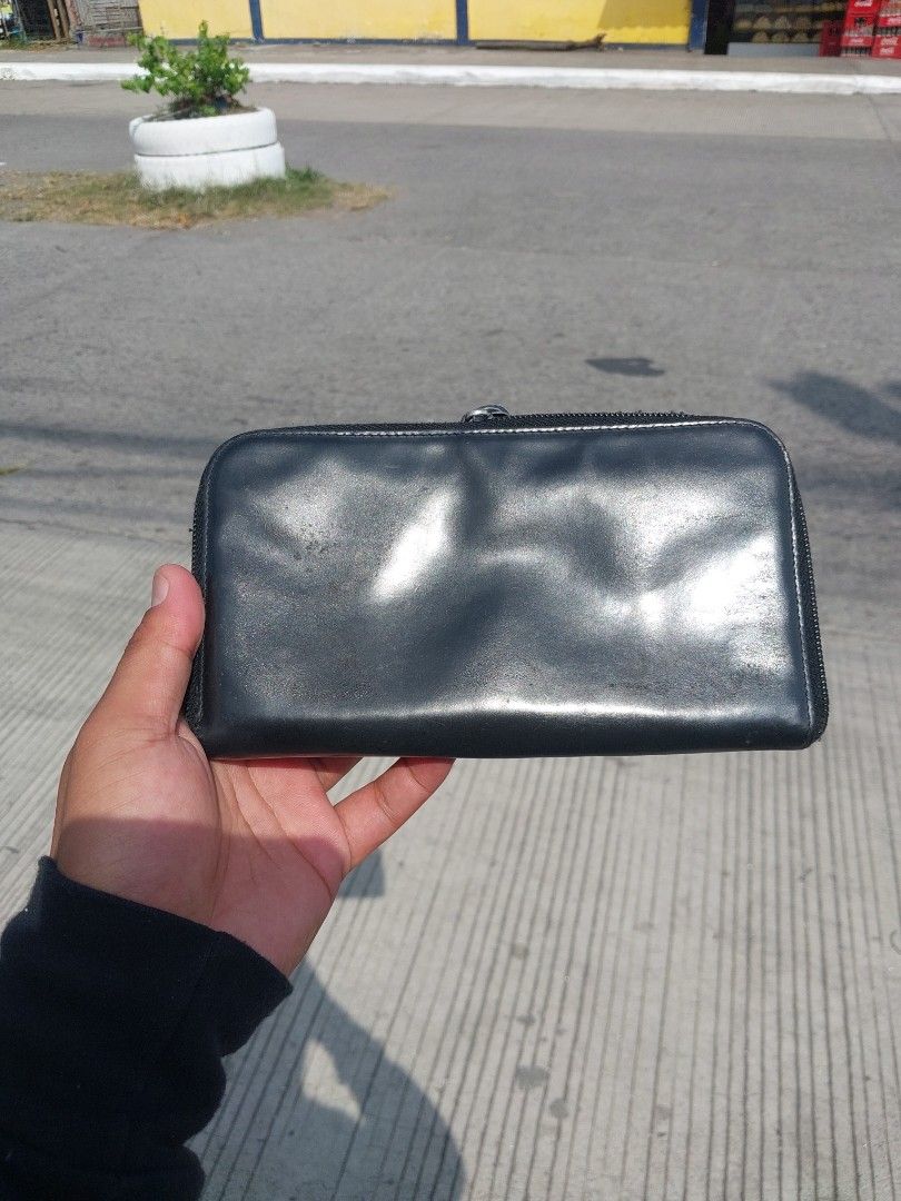 Prada Milano Black Leather Zip Around Wallet (Category: Luxury Bags & Wallets) located in Polomolok. Submitted by warmfire.3185dd (Listing ID 1455917481, Image 2). Description: - Authentic Prada Milano wallet - Black leather, zip-around style - Shows some signs of wear (exterior & interior) - LAMPO ZIPPER - Zipper functions smoothly - Ample card slots and compartments.