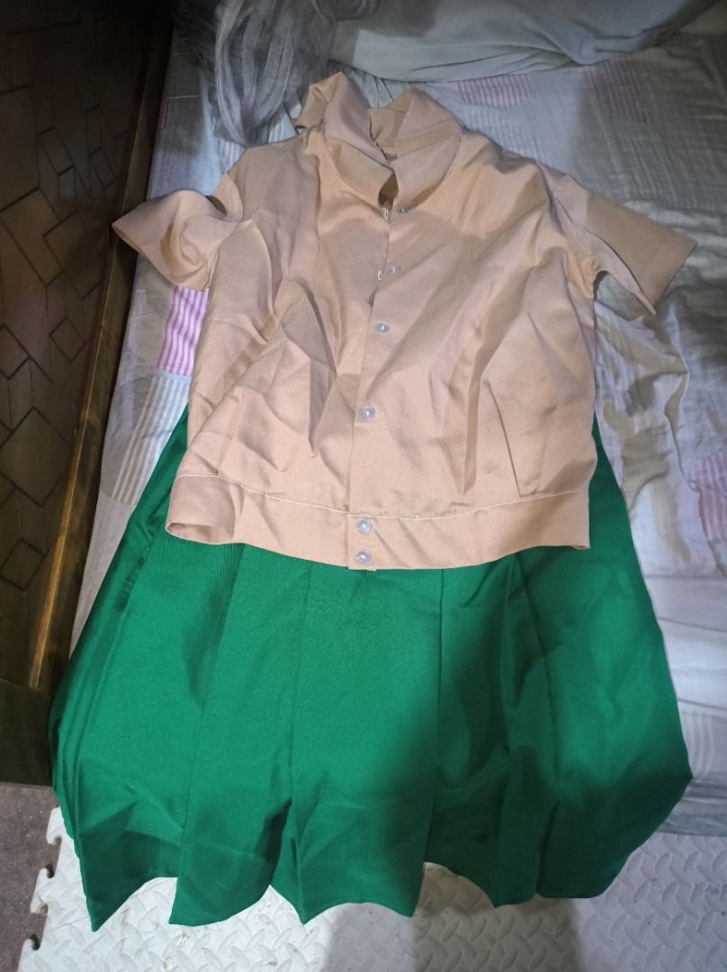 Quezon city high school uniform (Category: Sets or Coordinates) located in Manila. Submitted by silent_vonachiles (Listing ID 1455904088, Image 1). Description: - School uniform set - Includes light brown short-sleeved blouse - Green pleated skirt with size tag '128 65' - Ideal for school days - Ready for a new owner.
