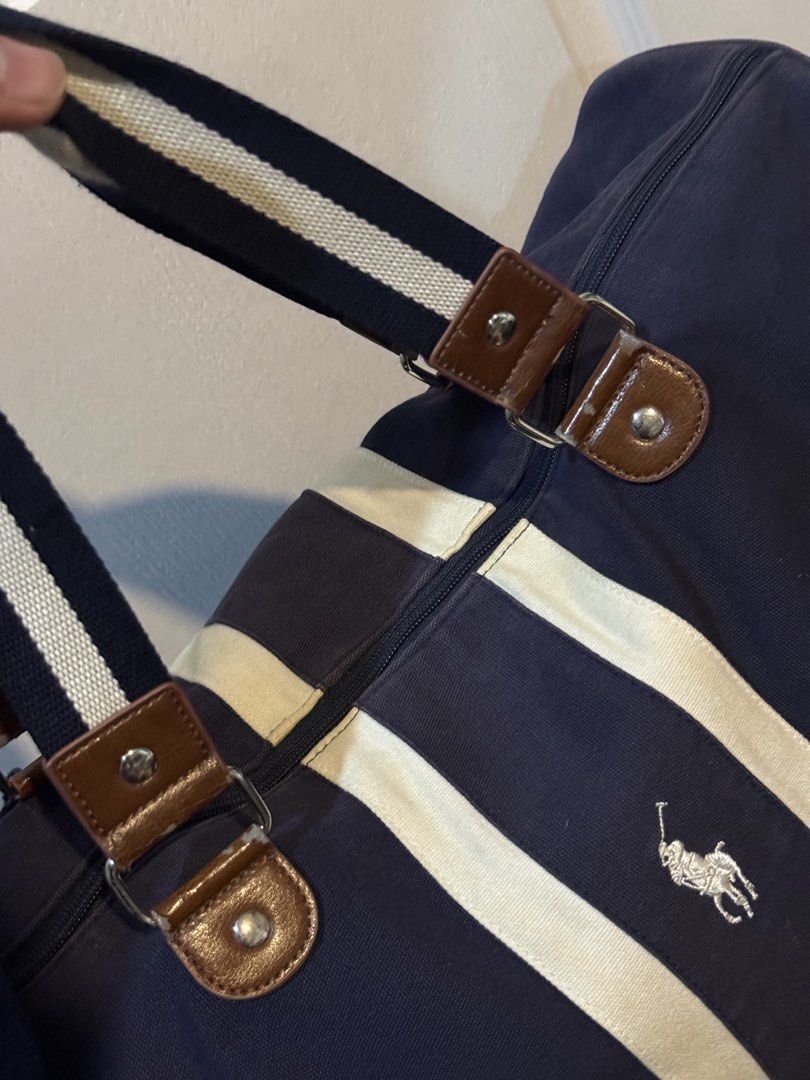Ralph Lauren Weekender Bag or Duffle Bag (Category: Sling Bags) located in Makati City. Submitted by johnf02 (Listing ID 1456010619, Image 2). Description: • Price: Php 890 • Well used, please refer to photos • Buy 2 items from my listings, get a discount • Sold on an as is, where is basis • Payment via GCash/Maya/BPI/BDO/Unionbank/GoTyme • Shipping to be shouldered by the buyer .