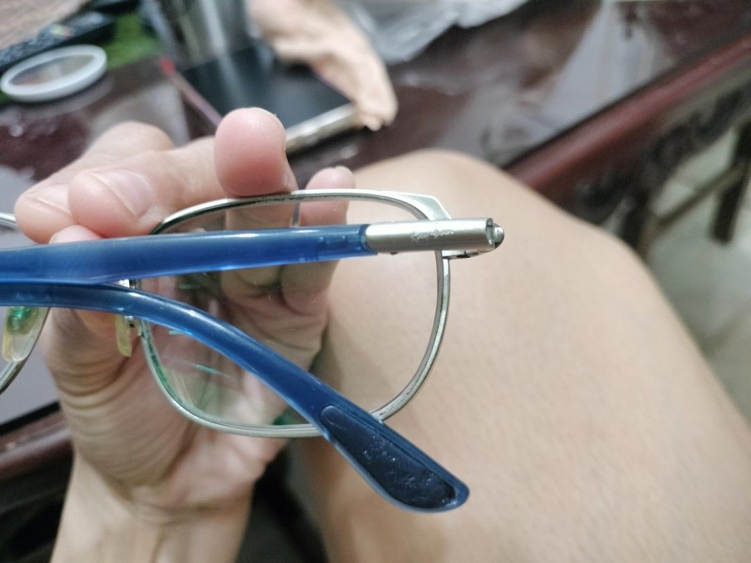 Ray-Ban Eyeglasses Frame Blue Silver Metal (Category: Sunglasses & Eyewear) located in Cavite. Submitted by indigence (Listing ID 1455881500, Image 3). Description: - Brand: Ray-Ban - Frame Material: Blue and silver metal - Frame Details: Blue arms with silver accents - Lens Width: 54mm - Bridge Width: 17mm - Arm Length: 145mm - Condition: Prescription lenses need replacement. Minor scuffs on frame. 100% original or authentic rfs: upgrade note: p