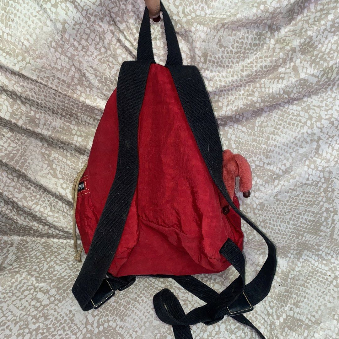 Red Kipling Mini Backpack with Monkey Charm (Category: Backpacks) located in Mandaluyong City. Submitted by hltabunda (Listing ID 1456003563, Image 2). Description: - Cute red Kipling mini backpack - Drawstring closure - Zip pockets for extra storage - Comes with signature Kipling monkey charm - Adjustable straps for a comfortable fit - Ideal for everyday use or travel - With minimal flaw (string in front).