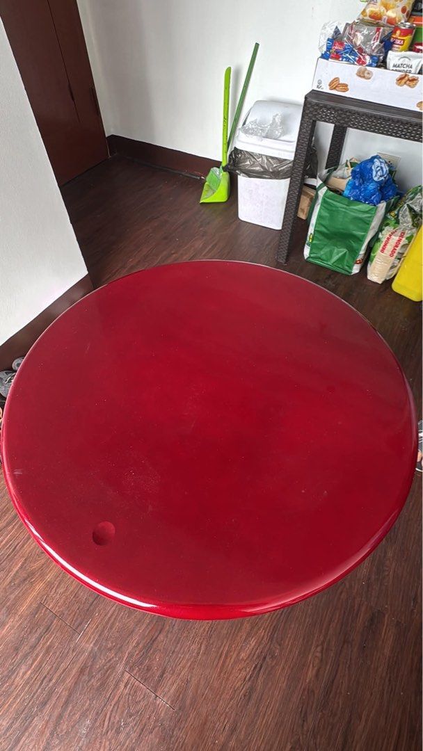 Red Round Bar Table with Adjustable Height (Category: Tables & Sets) located in Manila. Submitted by vitalshan00820 (Listing ID 1455894285, Image 2). Description: - Glossy red round bar table top - Adjustable height - Sturdy chrome base with weighted round design - Ideal for small spaces or as a convenient side table.