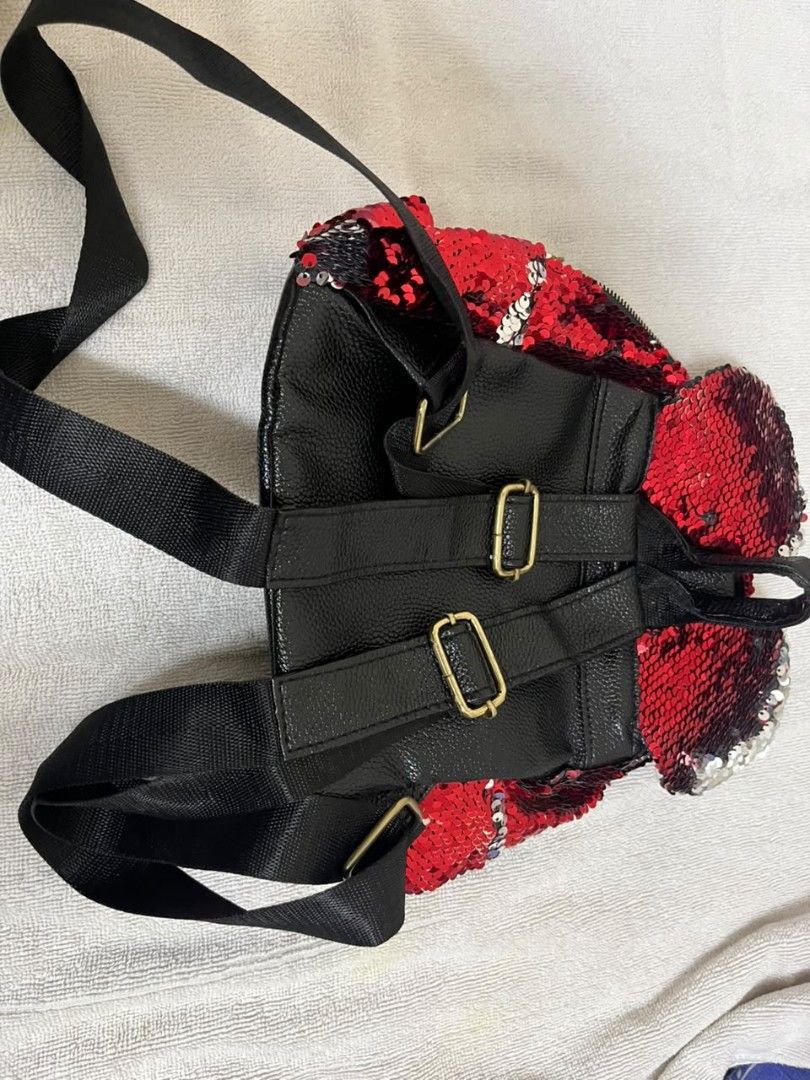 Red Sequin Mini Backpack (Category: Backpacks) located in Kuala Lumpur. Submitted by narresh_. (Listing ID 1455894652, Image 2). Description: - Eye-catching sparkly red sequin mini backpack - Features a convenient front zipper pocket - Spacious main compartment for your essentials - Adjustable black straps for a comfortable fit - Stylish gold hardware details - Ideal for parties, nights out, or travel adventures.