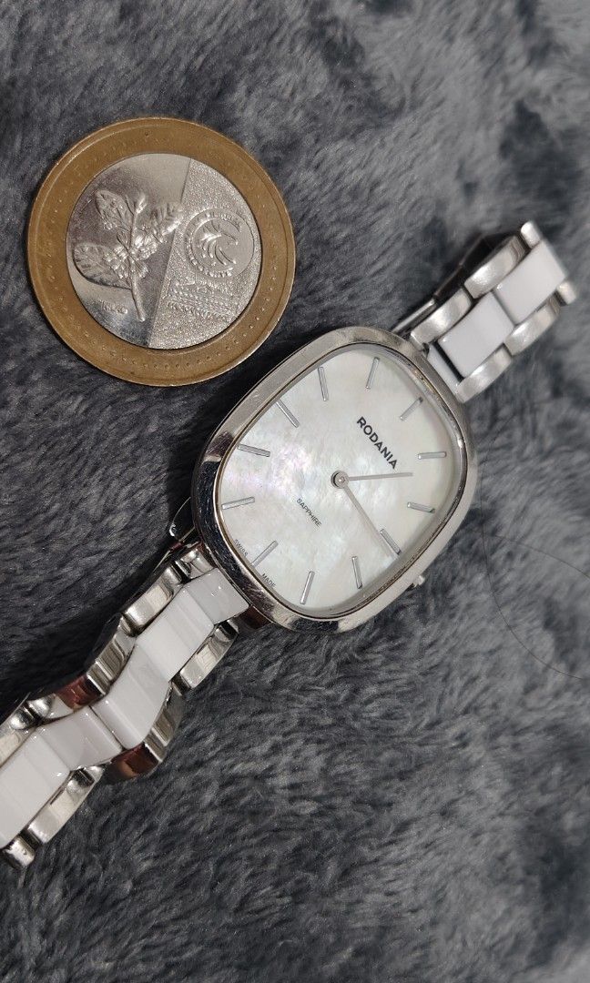Rodania Sapphire (ladies watch) (Category: Women's Watches) located in Cebu City. Submitted by aceoftime (Listing ID 1456029248, Image 2). Description: In good working condition Swiss Made Mother of Pearl dial Sapphire crystal face Ceramic- stainless steel bracelet Swiss analog quartz movt Watch only Our Guarantee: 💯 Authentic All watches are checked by our experienced tech to ensure good functionality Please manage your expectations since these