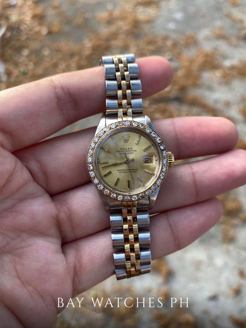 ROLEX Oyster Perpetual 26mm Custom Diamond Bezel (Category: Luxury Watches) located in Bulacan. Submitted by baywatchesph (Listing ID 1455907236, Image 1). Description: ROLEX Oyster Perpetual 26mm Custom Diamond Bezel Ref. 69173 Automatic movement 26mm case diameter Date display at the 3 o’clock position Custom diamond bezel Two-tone stainless steel & 18K gold 9/10 - In good condition With box and manual. See to appreciate..