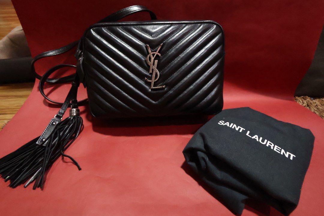 Saint Laurent Black Chevron Leather Camera Bag (Category: Luxury Bags & Wallets) located in Calamba. Submitted by danecingreyna (Listing ID 1455968137, Image 1). Description: - Authentic Saint Laurent black camera bag - Quilted chevron leather - Signature silver YSL logo hardware - Chic tassel detail - Comes with original dust bag - Ideal for everyday style and convenience - With dust bag - With authenticity cards - With pillow insert (free) - Gu