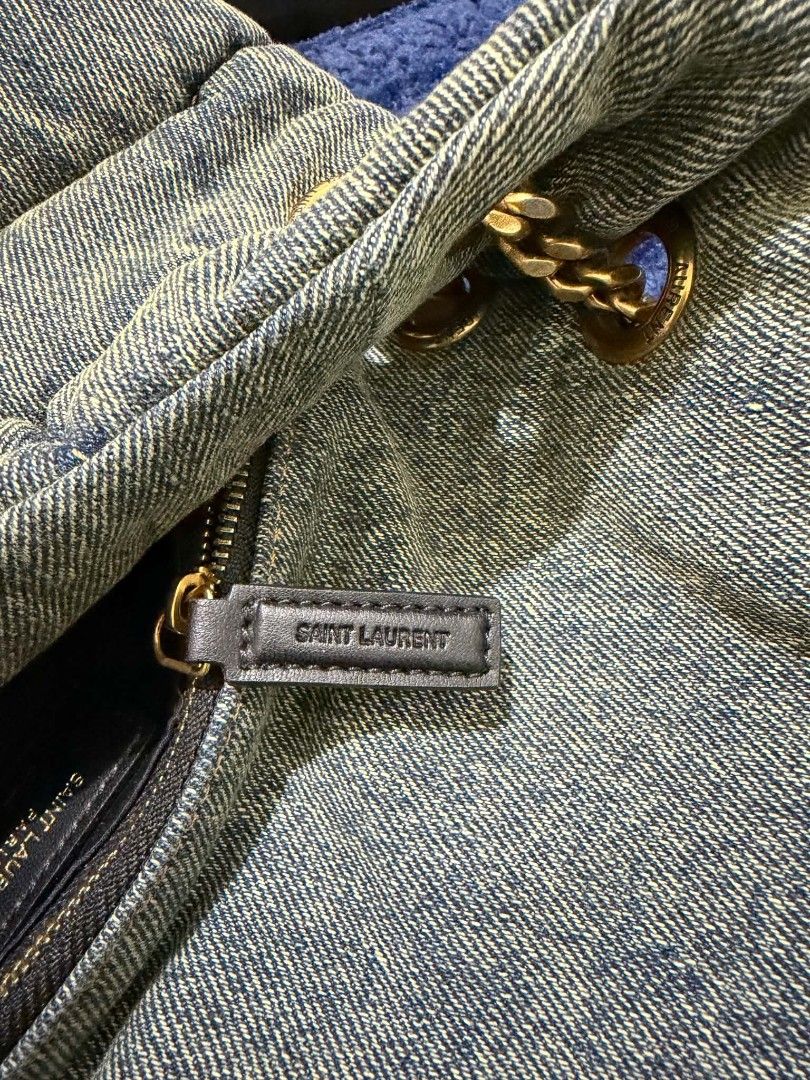 Saint Laurent Denim Puffer Shoulder Bag (Category: Luxury Bags & Wallets) located in Makati City. Submitted by lesleylorraine0103 (Listing ID 1455859351, Image 3). Description: - Dupe Saint Laurent denim puffer bag - Iconic YSL logo hardware - Gold chain strap with leather detail - Quilted denim exterior - Zipper closure with branded pull tab - Dust bag included - Ideal for casual outings.