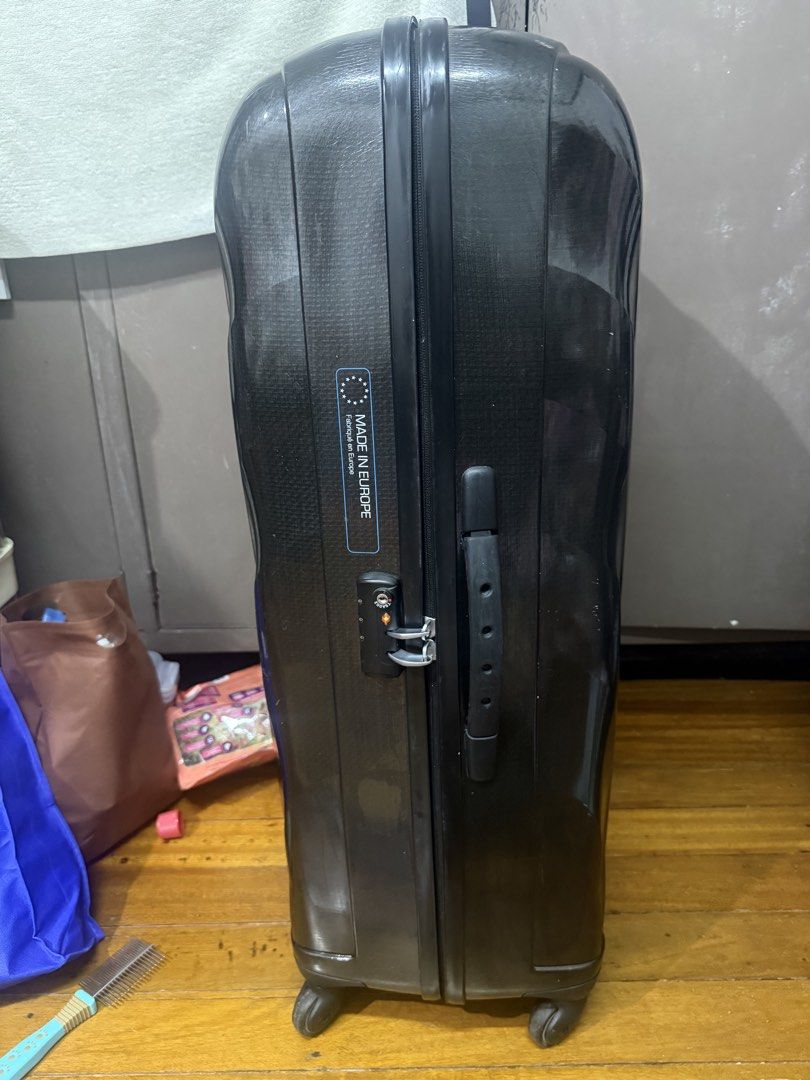 Samsonite Cosmolite Black XL (Category: Luggage) located in Manila. Submitted by potchi.thrifts (Listing ID 1456008713, Image 2). Description: NEGOTIABLE IF KUNIN TODAY - Black hard shell luggage - Made in Europe - Built-in combination lock - Shows normal scuffs and scratches from use - Wheels roll smoothly - Handle is functional - Spacious interior for travel.