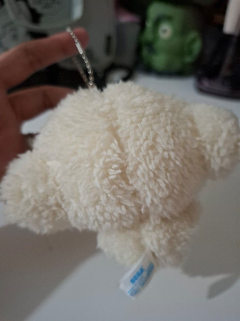 Sanrio Cogimyun charm plushie (Category: Plushies & Soft Toys) located in Orion. Submitted by timburtonfan (Listing ID 1455978837, Image 3). Description: - Adorable white fluffy plush keychain - Features charming yellow accents on top and bottom - Includes a small yellow patch with a red detail on the side - Comes with a durable metal keychain ring - Ideal accessory for decorating bags, backpacks, and more!.
