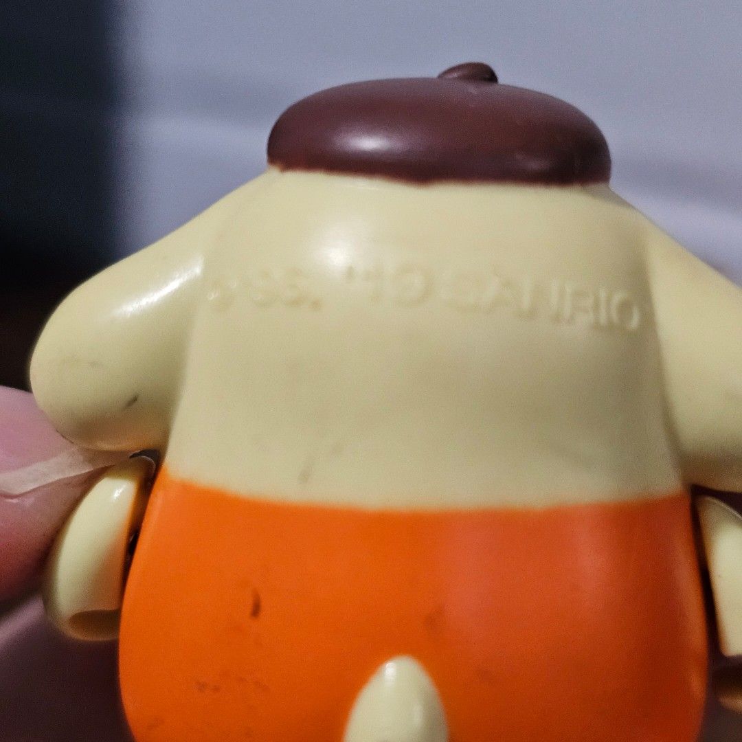 Sanrio Pompompurin Figure Toy (Category: Designer & Blind Box Toys) located in Rizal. Submitted by viviperera (Listing ID 1456025413, Image 2). Description: - Adorable Pompompurin figure by Sanrio. - Features the beloved yellow dog character in a cute orange vest. - Ideal for collectors and fans of Sanrio. - Compact size, perfect for display..