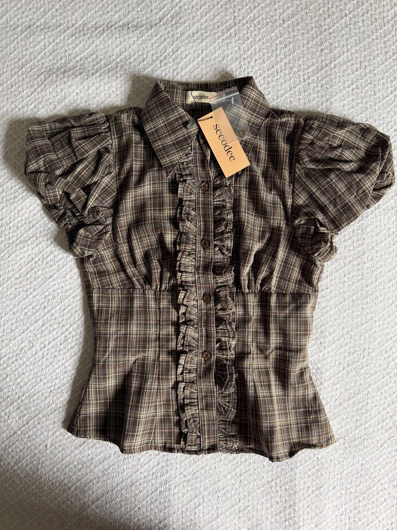 Secodee Vietnam | Plaid Ruffle Puff Sleeve Shirt (Category: Blouses) located in Manila. Submitted by stormuno (Listing ID 1455860965, Image 3). Description: Plaid Ruffle Puff Sleeve Shirt from Secodee •Size XS •Collared •Ruffles down the front •Button-up •Puff sleeves •Garterized sleeve openings •Gathered waist detail •Brand new with tags and paperbag •VV PREMIUM FABRIC!! Just bought this yesterday from Vietnam :) •RFS: Too small :(( (the salespe