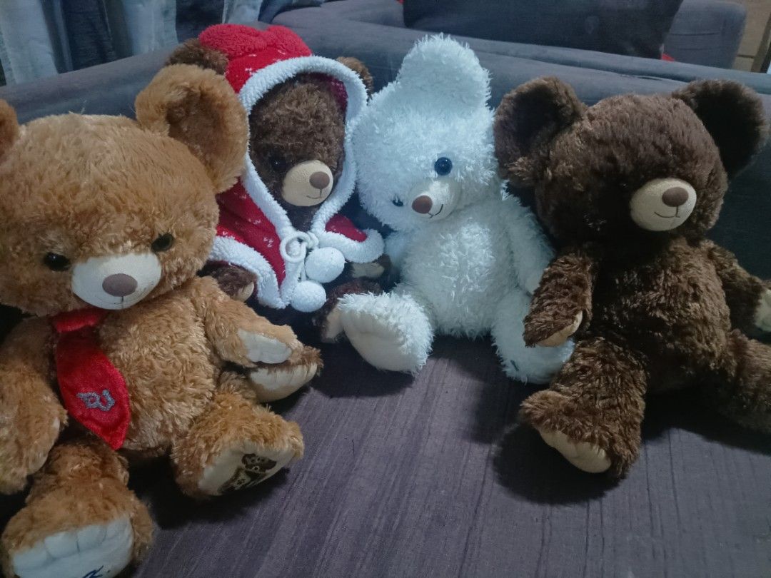 Set of 4 Cute Teddy Bears (Category: Plushies & Soft Toys) located in Taal. Submitted by zildreiven (Listing ID 1455894741, Image 1). Description: - Set of 4 adorable teddy bears - Includes: brown bear with red tie, brown bear in Santa outfit, white fluffy bear, and another brown bear - Great for teddy bear collectors - Perfect as a thoughtful gift.