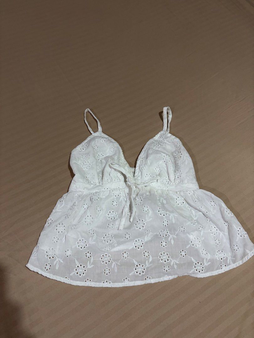 Shein White Eyelet Camisole Top with Tie Front (Category: Sleeveless) located in Antipolo. Submitted by pinkktopaz (Listing ID 1456034588, Image 1). Description: Size small fits xs-s Garterized back Used a couple of times only.