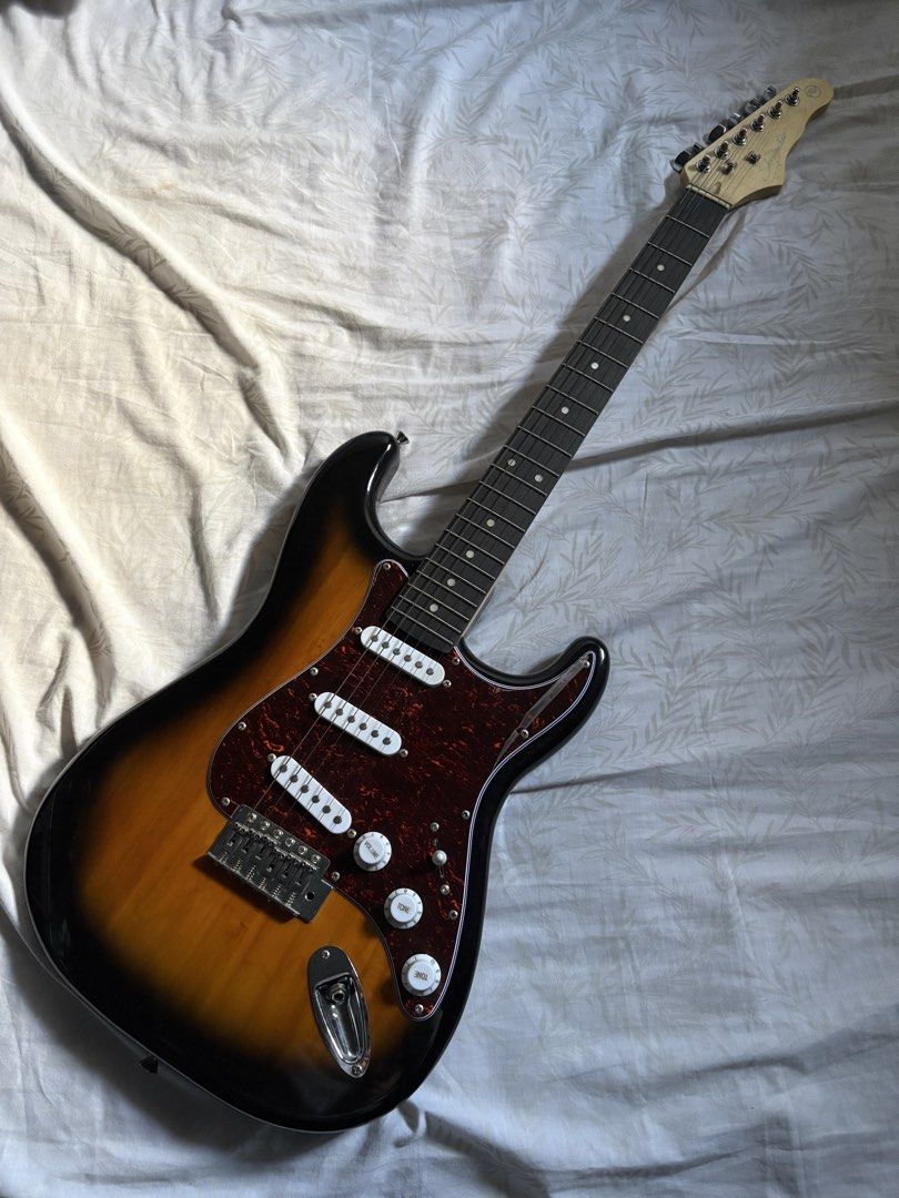 Skycaster Electric Guitar Sunburst (Category: Musical Instruments) located in Quezon City. Submitted by _rronnie (Listing ID 1455928611, Image 1). Description: RJ Guitar Skycaster Electric Guitar Stratocaster 2 tone Sunburst Tortoise Techwood with gig bag, cable, strap, tremolo arm barely played, no issues at all!.