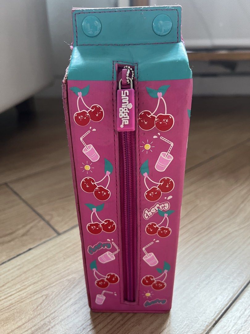 Smiggle pencil cases (Category: Stationery & School Supplies) located in Pasig City. Submitted by seller09876 (Listing ID 1168868384, Image 2). Description: Plastic - 200 Fruits print - 400 Ice cream print - 300 Hard case - 400 Milk carton - 400 Buyer pays for delivery fee .