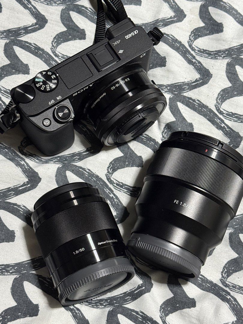 Sony Alpha a6400 Mirrorless Camera Bundle with Lenses & Bag (Category: Cameras) located in Manila. Submitted by gooddealsmanila (Listing ID 1456011710, Image 3). Description: - Sony Alpha a6400 camera body - Includes 16-50mm f/3.5-5.6 OSS kit lens - Comes with Sony FE 85mm f/1.8 lens - Also includes Sony 50mm f/1.8 OSS lens - Multiple extra batteries included - Battery charger included - Black camera bag included - Ideal for both photography and 