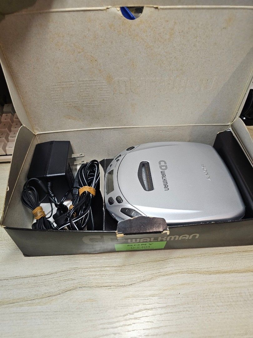 Sony Walkman D-E404 CD Player with Accessories (Category: Portable Music Players) located in Taguig. Submitted by k_ani (Listing ID 1456027175, Image 2). Description: - Silver Sony Walkman D-E404 CD Player - Includes original box - Includes AC adapter - Includes original earphones - Manual included - Tested and confirmed working - Great for playing your old CD collection.