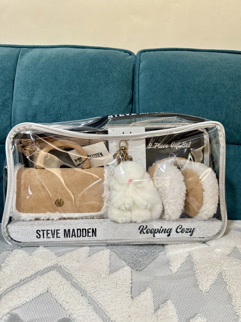 Steve Madden 3 Piece "Keeping Cozy" Gift Set (Category: Luxury Bags & Wallets) located in Taguig. Submitted by fabnuztique (Listing ID 1455910968, Image 2). Description: - Steve Madden 3-piece gift set - Includes: fuzzy handbag, fluffy keychain, ear mulls - Handbag features a detachable strap - All items presented in a clear PVC bag - Ideal for gifting or personal treat.