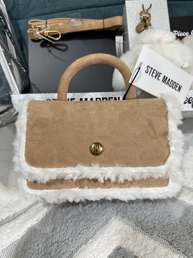 Steve Madden 3 Piece "Keeping Cozy" Gift Set (Category: Luxury Bags & Wallets) located in Taguig. Submitted by fabnuztique (Listing ID 1455910968, Image 3). Description: - Steve Madden 3-piece gift set - Includes: fuzzy handbag, fluffy keychain, ear mulls - Handbag features a detachable strap - All items presented in a clear PVC bag - Ideal for gifting or personal treat.