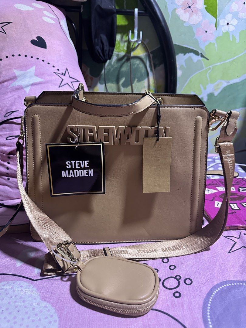 Steve Madden Bevelyn Special Edition Handbag (Category: Luxury Bags & Wallets) located in Manila. Submitted by edgiedge (Listing ID 1456022572, Image 2). Description: - Brand new Steve Madden Bevelyn Handbag - Special Edition: Bigger & Better New Size - Detachable strap included - Comes with a small coin pouch - Elegant gold hardware details - Embossed Steve Madden logo on the front - Tags are still attached 📍Tondo.