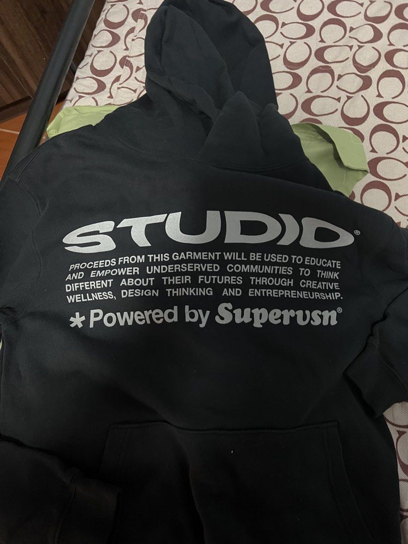 STUDIO "Powered by Superusn" Black Hoodie (Category: Hoodies) located in Antipolo. Submitted by murapod2 (Listing ID 1456053575, Image 3). Description: - Black hoodie from STUDIO - Features 'Powered by Superusn' graphic print on front and back - Proceeds support education and empowerment for underserved communities - Size S - Made in China - Ideal for casual wear. -fit to medium .