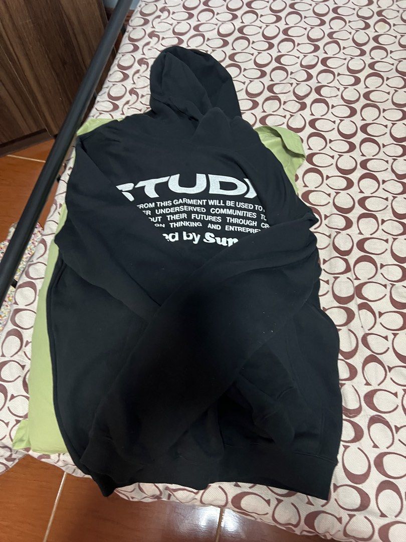 STUDIO "Powered by Superusn" Black Hoodie (Category: Hoodies) located in Antipolo. Submitted by murapod2 (Listing ID 1456053575, Image 2). Description: - Black hoodie from STUDIO - Features 'Powered by Superusn' graphic print on front and back - Proceeds support education and empowerment for underserved communities - Size S - Made in China - Ideal for casual wear. -fit to medium .
