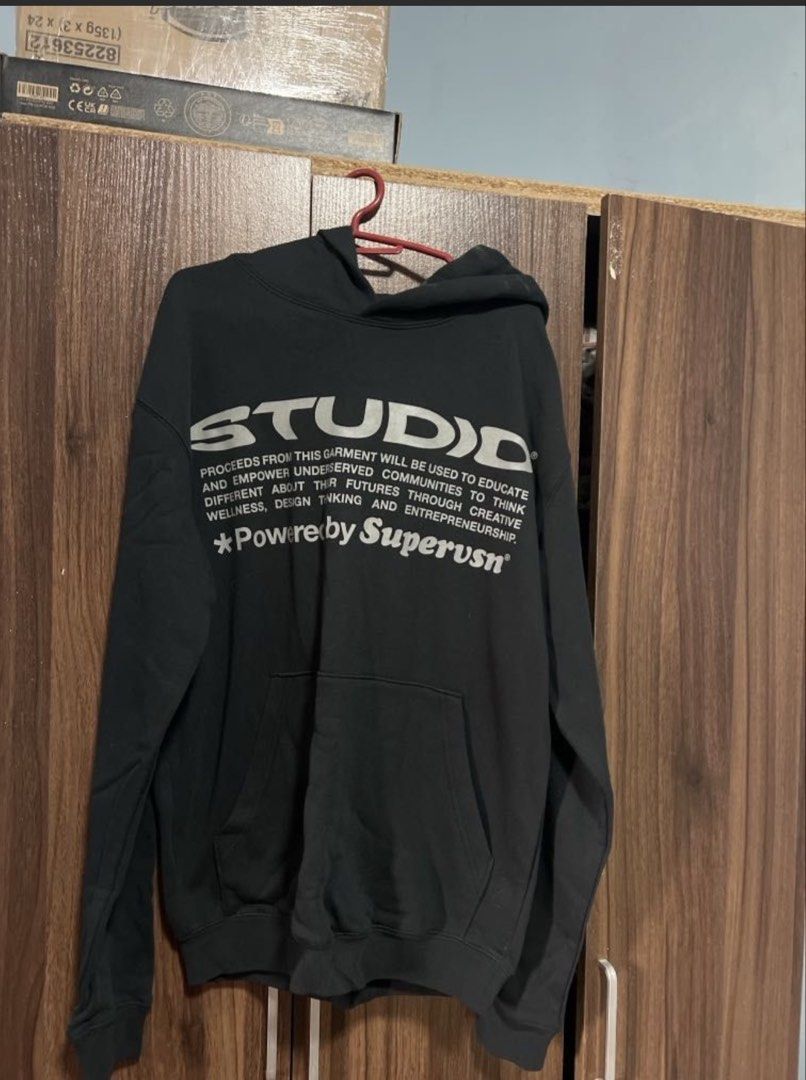 STUDIO "Powered by Superusn" Black Hoodie (Category: Hoodies) located in Antipolo. Submitted by murapod2 (Listing ID 1456053575, Image 1). Description: - Black hoodie from STUDIO - Features 'Powered by Superusn' graphic print on front and back - Proceeds support education and empowerment for underserved communities - Size S - Made in China - Ideal for casual wear. -fit to medium .