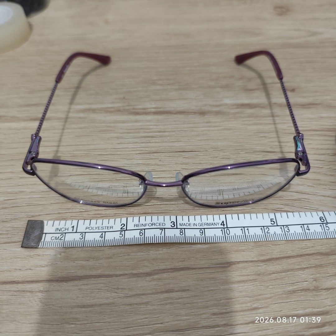 Superflex Stainless Steel Eyeglasses with Case (Category: Sunglasses & Eyewear) located in Paranaque City. Submitted by ipuno_ (Listing ID 1456033029, Image 2). Description: - Purple Superflex eyeglasses - Made of durable stainless steel - Comes with a blue hard case - Case features 'CAPITAL VISION CARE' and 'www.cvcyeg.com' - Ideal for everyday wear.