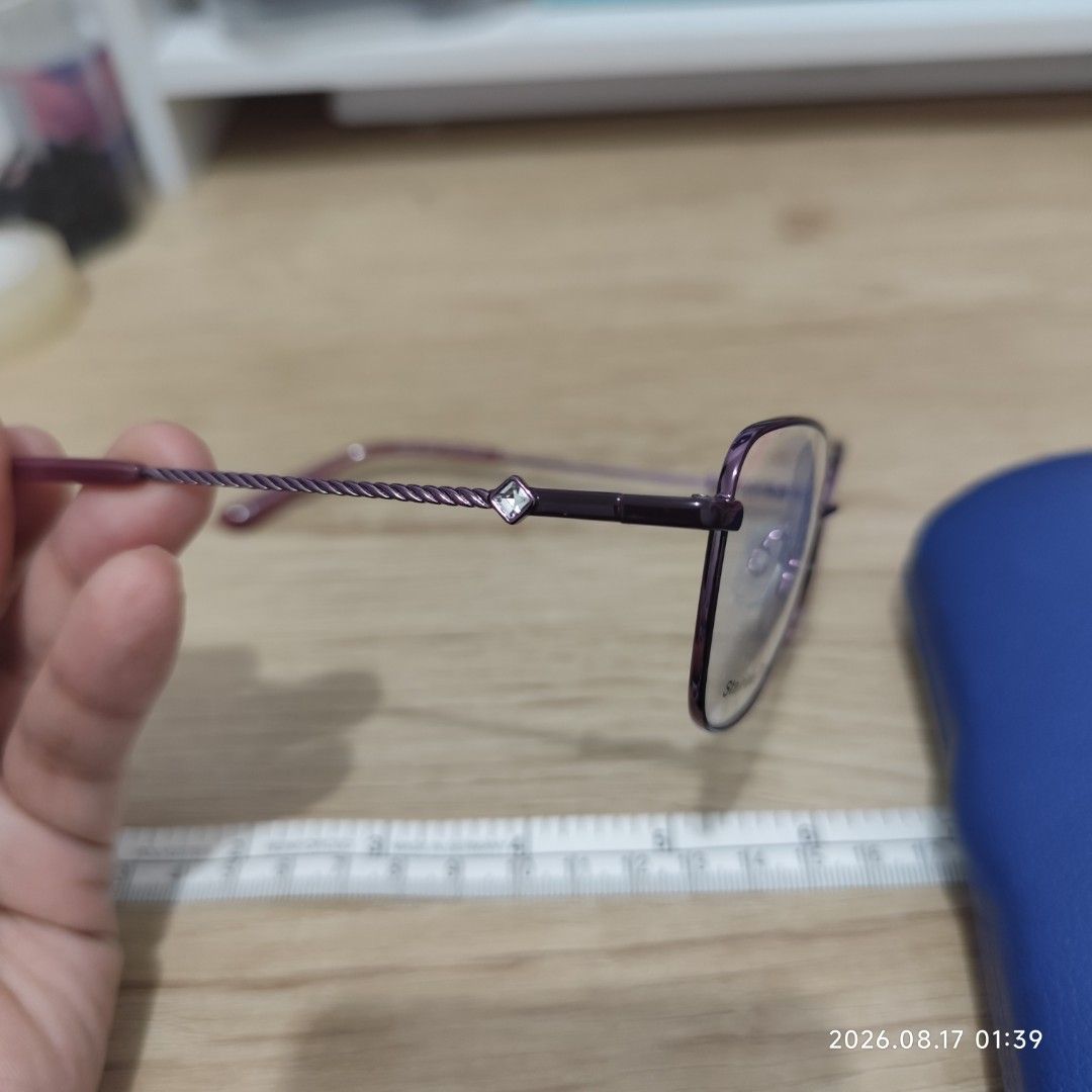 Superflex Stainless Steel Eyeglasses with Case (Category: Sunglasses & Eyewear) located in Paranaque City. Submitted by ipuno_ (Listing ID 1456033029, Image 3). Description: - Purple Superflex eyeglasses - Made of durable stainless steel - Comes with a blue hard case - Case features 'CAPITAL VISION CARE' and 'www.cvcyeg.com' - Ideal for everyday wear.