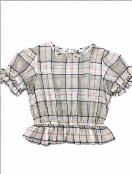 Tayo Plaid Puff Sleeve Peplum Top (Category: Blouses) located in Las Pinas. Submitted by katb86 (Listing ID 1455926057, Image 1). Description: - Cute plaid design - Short puff sleeves with ruffled cuffs - Smocked waist - Ruffled hem - Versatile: pairs well with jeans or skirts - Ideal for casual outings.