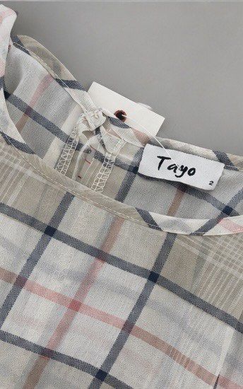 Tayo Plaid Puff Sleeve Peplum Top (Category: Blouses) located in Las Pinas. Submitted by katb86 (Listing ID 1455926057, Image 2). Description: - Cute plaid design - Short puff sleeves with ruffled cuffs - Smocked waist - Ruffled hem - Versatile: pairs well with jeans or skirts - Ideal for casual outings.