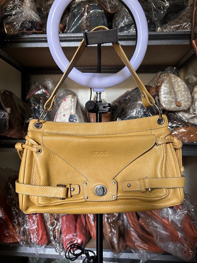 TOD'S Butter Yellow Leather Shoulder Bag (Category: Luxury Bags & Wallets) located in Butuan. Submitted by slownsteady_ (Listing ID 1455930108, Image 1). Description: - Authentic TOD'S butter yellow leather shoulder bag - Textured leather exterior with stylish buckle details - Secure zip closure for the main compartment - Interior zip pocket for essentials - Adjustable straps for a customized fit - Ideal everyday bag for a touch of luxury.
