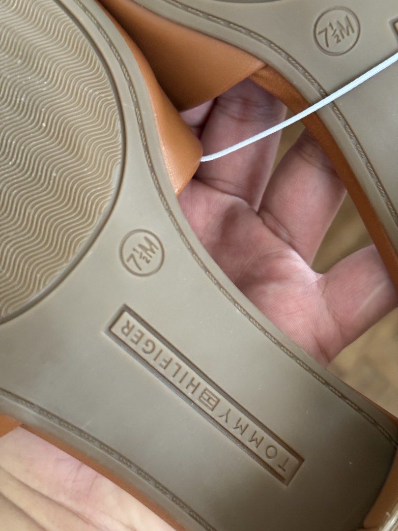Tommy Hilfiger Penni Slide Sandal (Category: Heels) located in San Carlos City. Submitted by achisfinds (Listing ID 1455865823, Image 3). Description: US 7 1/2 COLOR: Tan Bought from the US A logo at the top strap and adds heritage style to this block-heel sandal fronted by a square toe 1 1/2” heel.