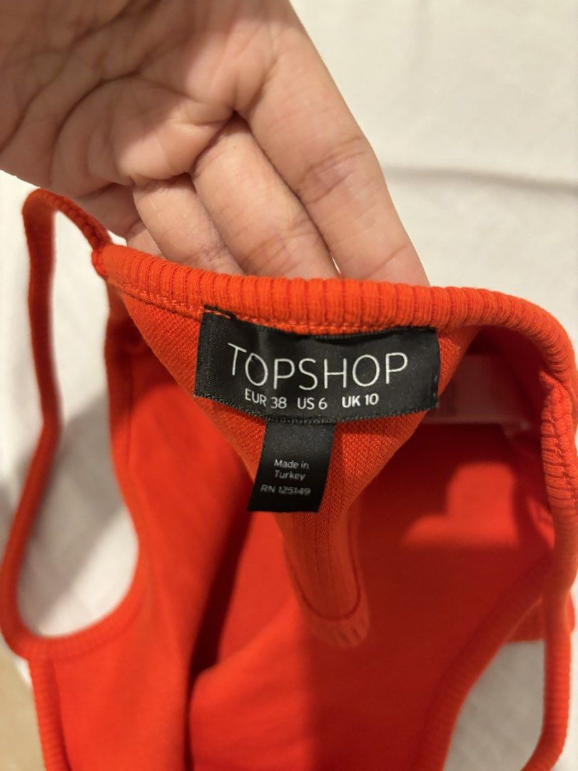 Topshop Red Halter Crop Top (Category: Sleeveless) located in Quezon City. Submitted by __declutterwithme (Listing ID 1455970979, Image 2). Description: - Origin: Made in Turkey - Versatile: Great for casual outings or dressing up.