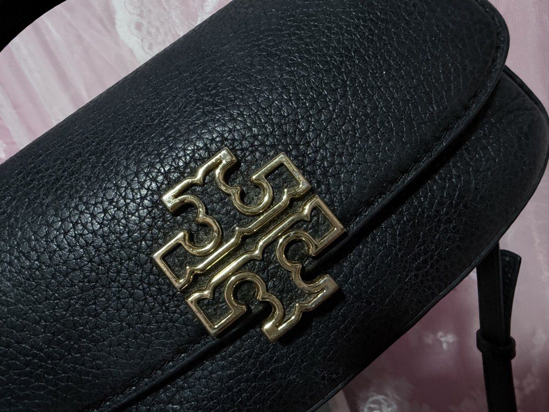 Tory Burch Britten Black Leather Mini Top Handle Bag (Category: Luxury Bags & Wallets) located in Cauayan City . Submitted by rianna12_ (Listing ID 1455873637, Image 3). Description: Original/Authentic Tory butch mini britten rfs: decluttering minor flaws: seen on picture can fit a lot! bought for 12k still negotiable alagang alaga still looking new .
