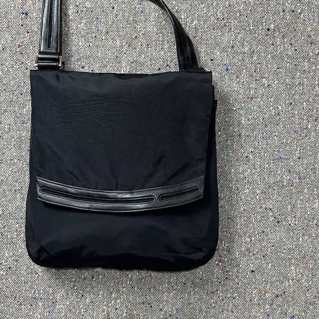 TUMI Ballistic Nylon Messenger/Shoulder Bag (Category: Luxury Bags & Wallets) located in Zamboanga. Submitted by deconstrukt.fit (Listing ID 1456042723, Image 2). Description: TUMI Ballistic Nylon Messenger/Shoulder Bag Measurement by tape Length: 11.5” Inch Width: 11” Inch Depth: 9” Inch Condition: Excellent No Flaws -Adjusted leather strap Interior Organization Main Compartment: Spacious enough for a tablet, a large wallet, or a small umbrella.