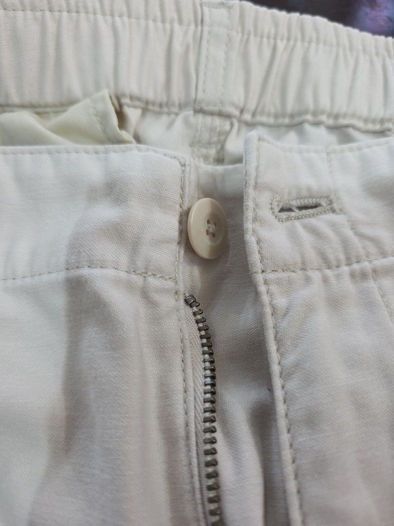 Uniqlo Cream Cargo Pants (Category: Other Bottoms) located in Bulacan. Submitted by declutterwithme4 (Listing ID 1455976303, Image 2). Description: - Cream colored cargo pants - Button and zip front closure - Ideal for casual wear - Versatile for styling with various tops - Waist: 30-33 inches, Length 39 inches.
