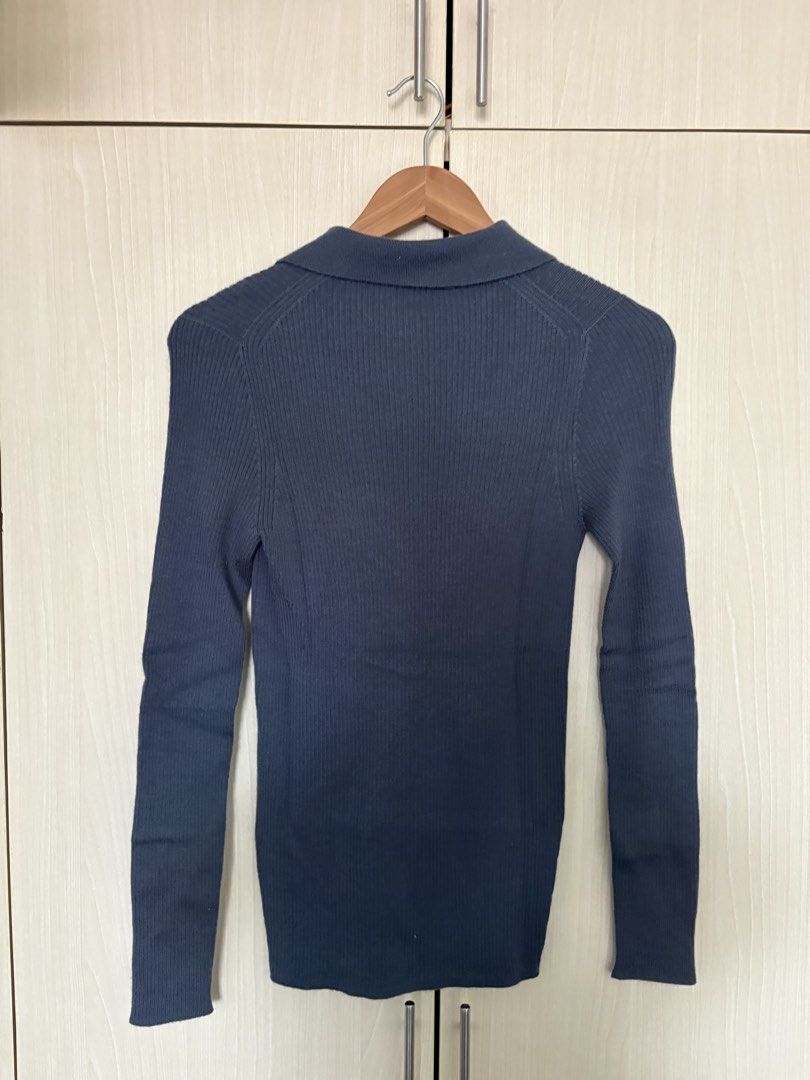 Uniqlo U Ribbed Knit Collared Cardigan (Category: Coats, Jackets and Outerwear) located in Paranaque City. Submitted by chicrepeats (Listing ID 1455885980, Image 2). Description: - Uniqlo U Ribbed Knit Cardigan - Color: Dark Grey/Navy - Features: Long sleeves, collared neckline, button-up front - Style: Versatile for layering or wearing alone - Comfort: Comfortable and easy to wear.