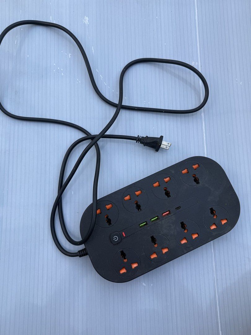 Universal Power Strip with USB Ports and Type C (Category: Electrical, Adaptors & Sockets) located in Manila. Submitted by gooddealsmanila (Listing ID 1456004612, Image 2). Description: - Black power strip with 8 universal sockets - 3 USB-A ports - 1 TYPE C - Power button with indicator light - Includes cord and plug - Ideal for charging multiple devices simultaneously.