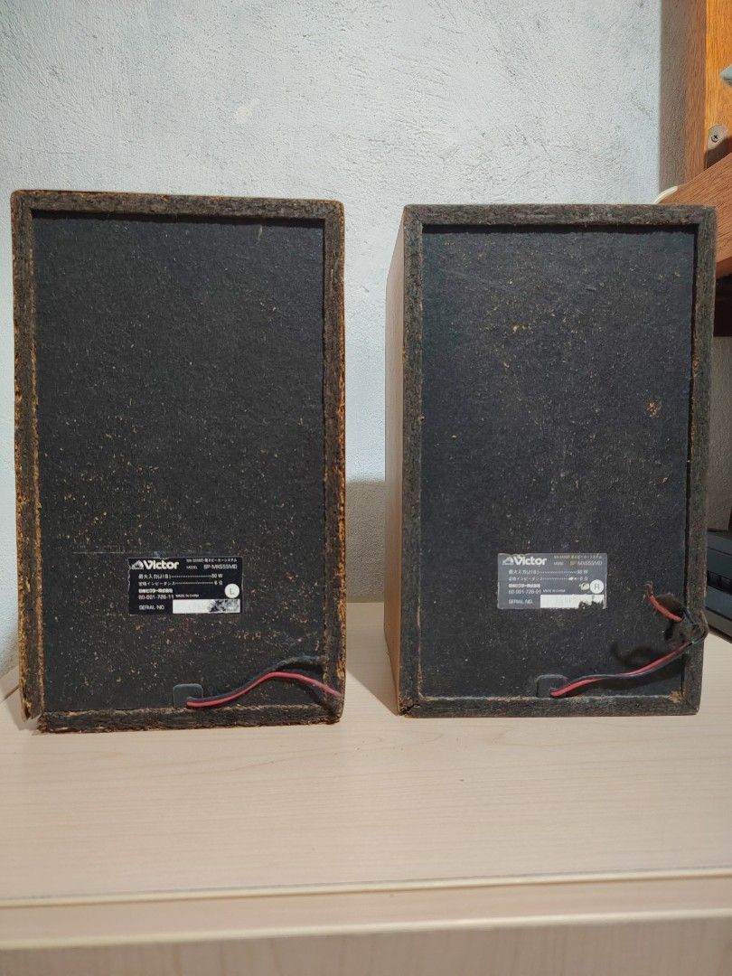 Victor SP-MX555MD Speakers (Pair) (Category: Soundbars, Speakers & Amplifiers) located in Taguig. Submitted by jeraativo (Listing ID 1455943773, Image 3). Description: - Victor SP-MX555MD Speakers - Wood grain finish on sides - Fabric covers on front - Tested and confirmed working - Minor signs of wear on fabric covers and wood edges - Delivers great sound quality.